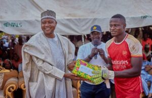 Barr. Yakubu Galada, an Abuja/Lagos based legal luminary presenting a gift item to one of the players 