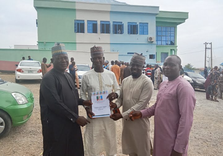 Caretaker Committee Chairman of Kogi LGC, Hon Musa Abdulmalik (M) in a group photograph with some APC stakeholders from Kogi LG shortly after picking his chairmanship nomination forms at APC State secretariat Lokoja on Tuesday