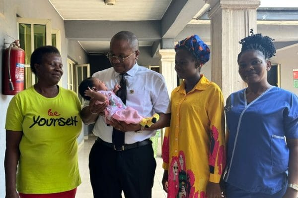 Hon. Collins Ugochukwu Iheonunekwu, lawmaker representing Isiala Ngwa North (M) with mother and others