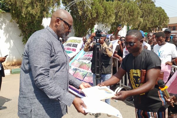 Secretary to the State Government, SSG, Dr Kingsley Emu receiving letter of protesters