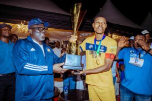 Delta State Governor, Rt Hon Sheriff Oborevwori (left), presenting the winner's Trophy to the Captain of Team Udumurhie, Mr. Emobonuvie Rukevwe during the grand finale of the Osubi Community Unity Cup, Osubi in Okpe LGA on Sunday. Pix Enarusai Bripin