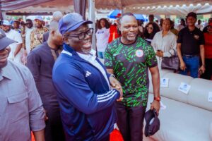 Delta State Governor, Rt Hon Sheriff Oborevwori (left), exchanging pleasantries with a former Supper Eagle Player, Mr. Victor Ekpeba during the grand finale of the Osubi Community Unity football Competition at Osubi Secondary School, Osubi in Okpe LGA on Sunday. Pix Enarusai Bripin 