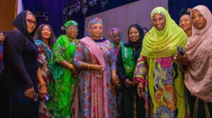 AWTPN National Chairman, Tpl. Rekiyat Ahuoiza Fache in a photograph with the Hon. Minister of Women Affairs, Hajiya Imaan Sulaiman Ibrahim and other dignitaries in Abuja